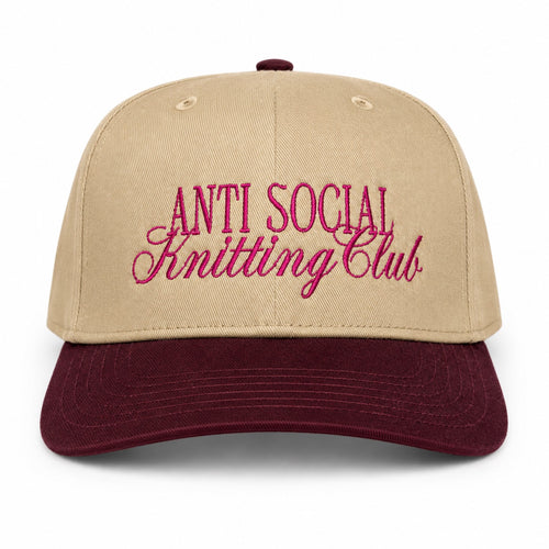 Khaki and burgundy structured hat with dark pink Anti Social Knitting Club embroidery