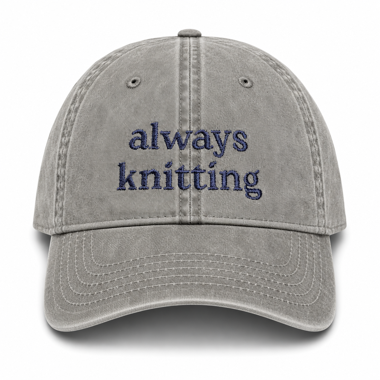 Gray cap with 'always knitting' text on a white background