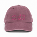 Mauve cap with 'could be worsted' text on a white background