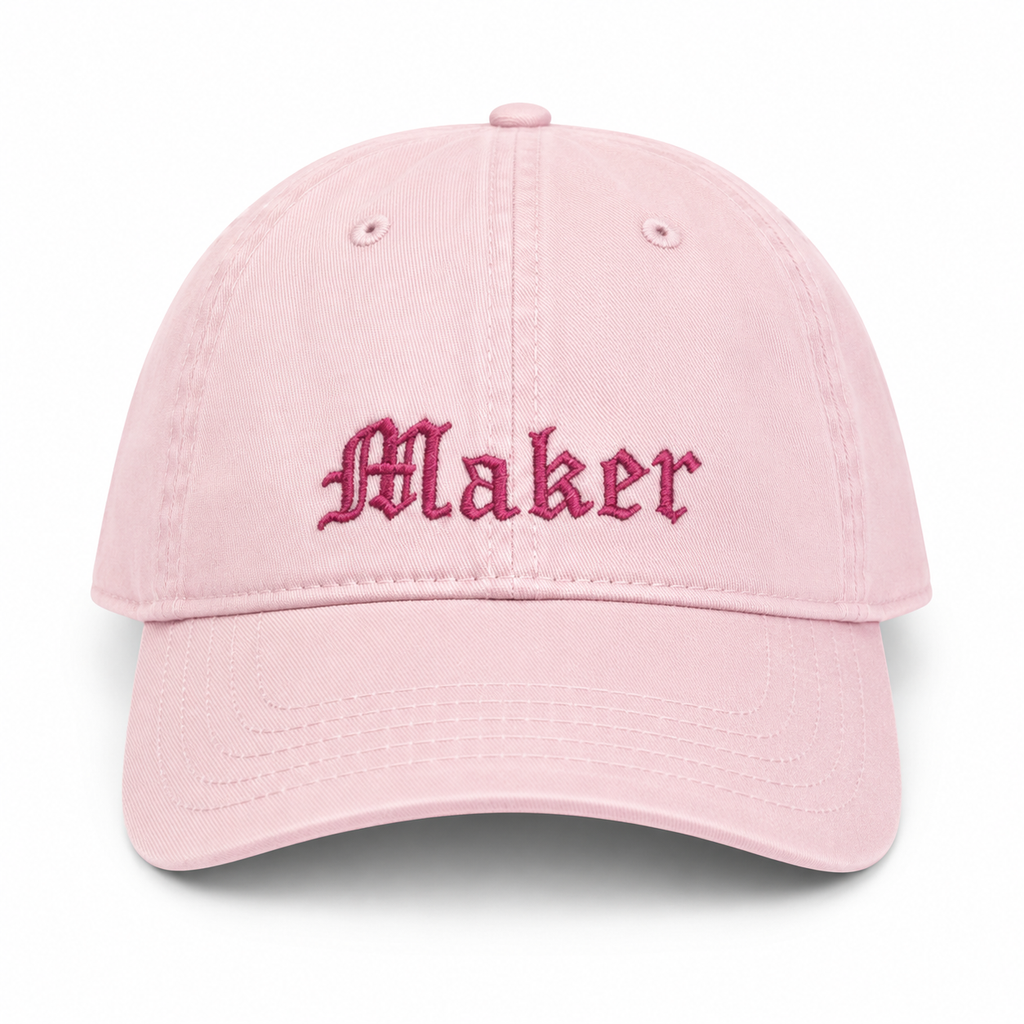 Pink cap with 'Maker' embroidered on a white background