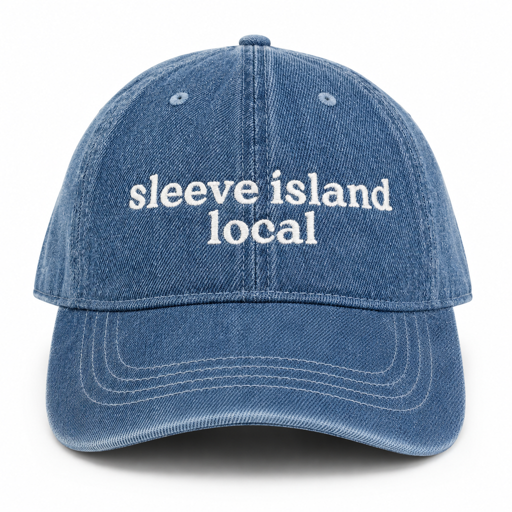 Blue denim cap with 'sleeve island local' text on a white background