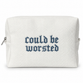 A white waffle-weave zippered pouch with the phrase 'could be worsted' embroidered in a dark blue Gothic font on the front, shown against a plain white background.