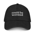 Black cap with 'could be worsted' text on a white background