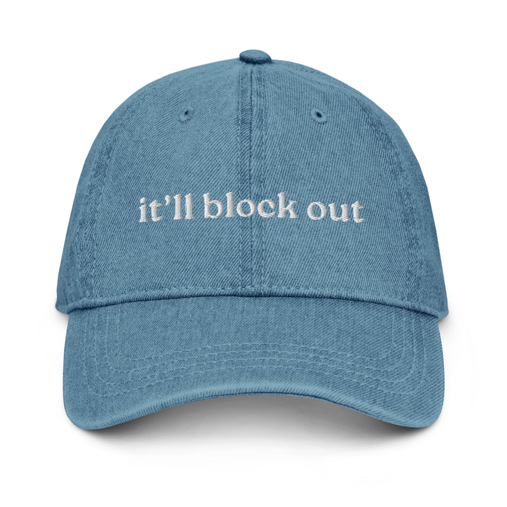 Blue cap with embroidered text on a white background