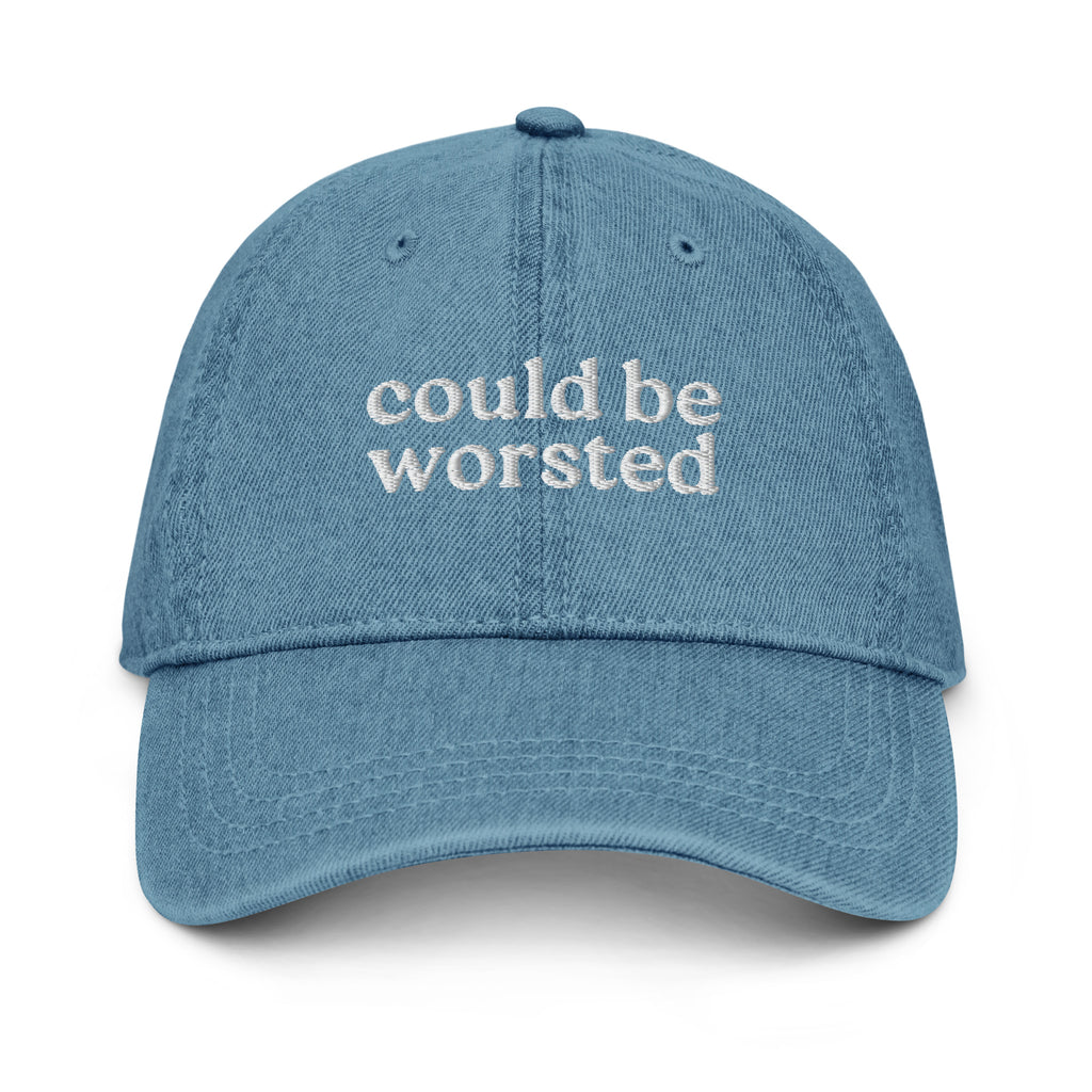 Blue cap with ''could be worsted' text on a white background