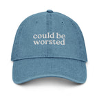 Blue cap with ''could be worsted' text on a white background