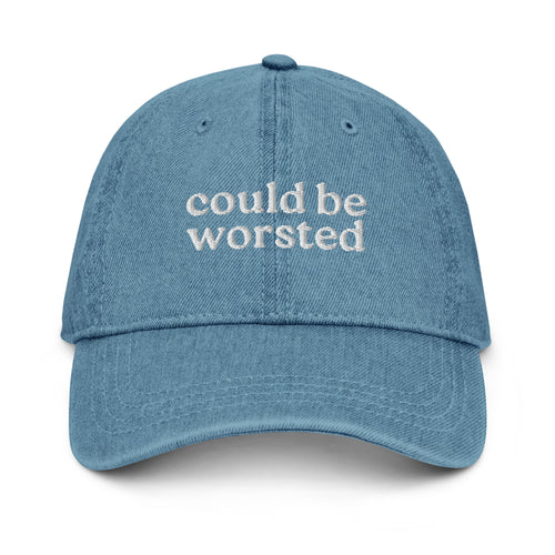 Blue cap with ''could be worsted' text on a white background