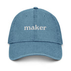 Blue cap with text 'maker' on a white background