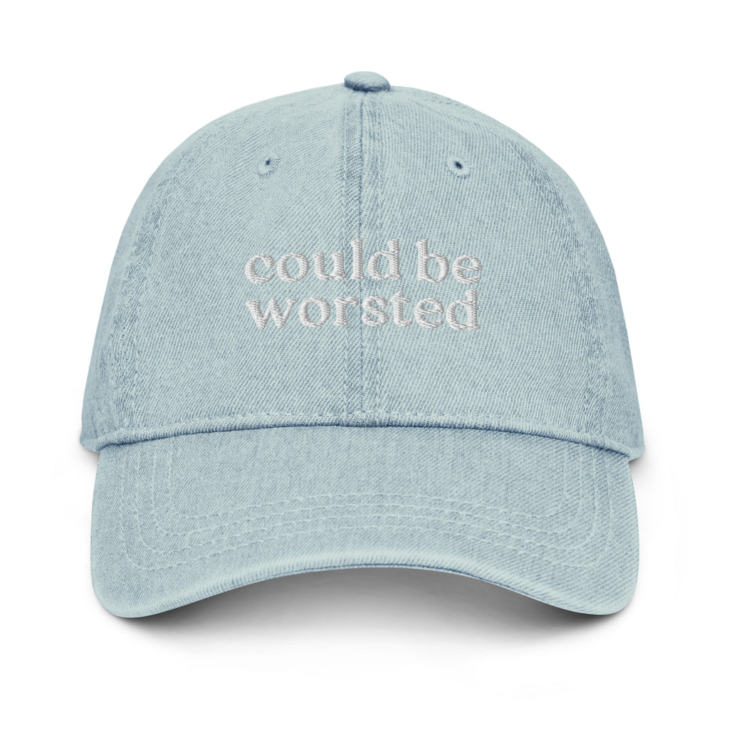 Light blue cap with ''could be worsted' ' text on a white background