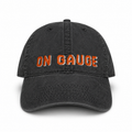 Black cap with 'ON GAUGE' text in orange on a white background