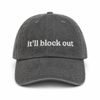 Gray cap with 'it'll block out' text on a white background