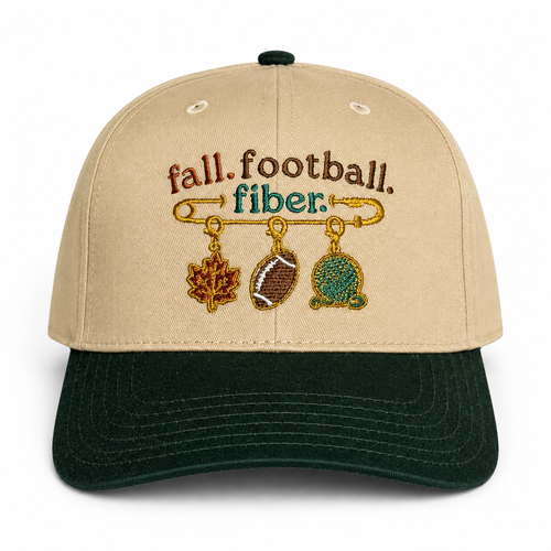 A beige and dark green baseball cap with embroidered text reading 'fall. football.