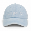 Light blue denim cap with 'off gauge' text on a white background