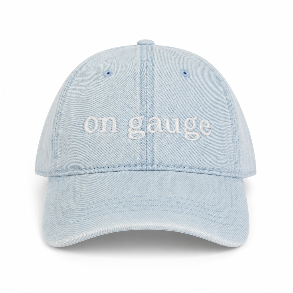 Light blue cap with 'on gauge' text on a white background