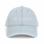 Light blue cap with 'on gauge' text on a white background