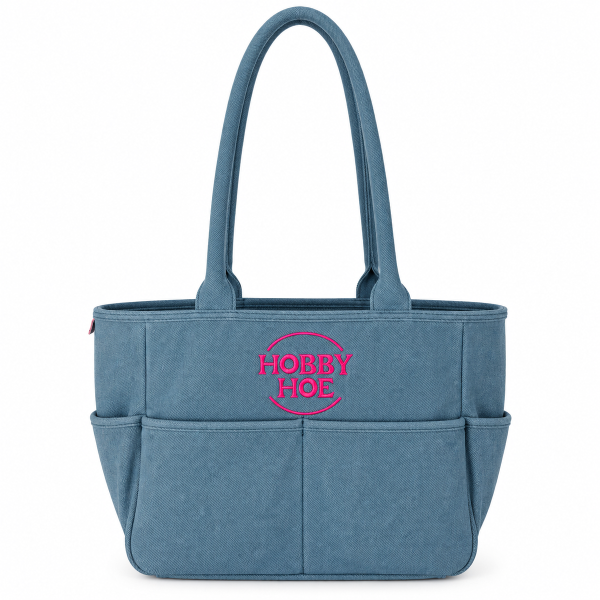 A blue fabric organizer tote bag with two top handles, multiple front pockets, and a pink embroidered 'HOBBY HOE' logo on the front, shown against a plain white background.