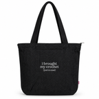 A black canvas tote bag with two shoulder straps, featuring the white printed text 'i brought my crochet (just in case)' on the front, set against a plain white background.