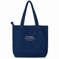 A dark blue denim tote bag with two shoulder straps, featuring the embroidered text 'i brought my knitting (just in case)' in light beige on the front, set against a plain white background.