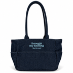 A dark navy blue canvas tote bag with two top handles and a front pocket, featuring the text 'i brought my knitting (just in case)' printed in light blue on the front, set against a plain white background.