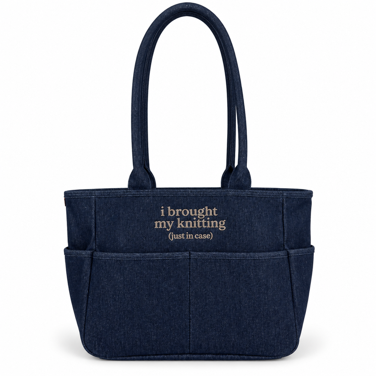 Dark denim TIMI Tote with taupe “I brought my knitting (just in case)” embroidery.