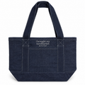 A dark navy blue canvas tote bag with white contrast stitching, dual top handles, and white embroidered text on the front pocket that reads 'i brought my needlepoint (just in case)'.
