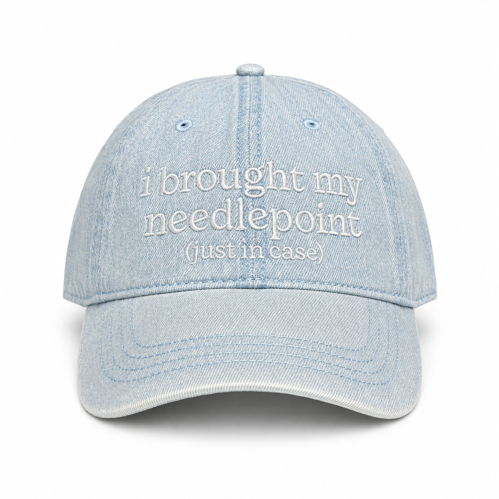 Light blue cotton dad hat with white I Brought My Needlepoint embroidery