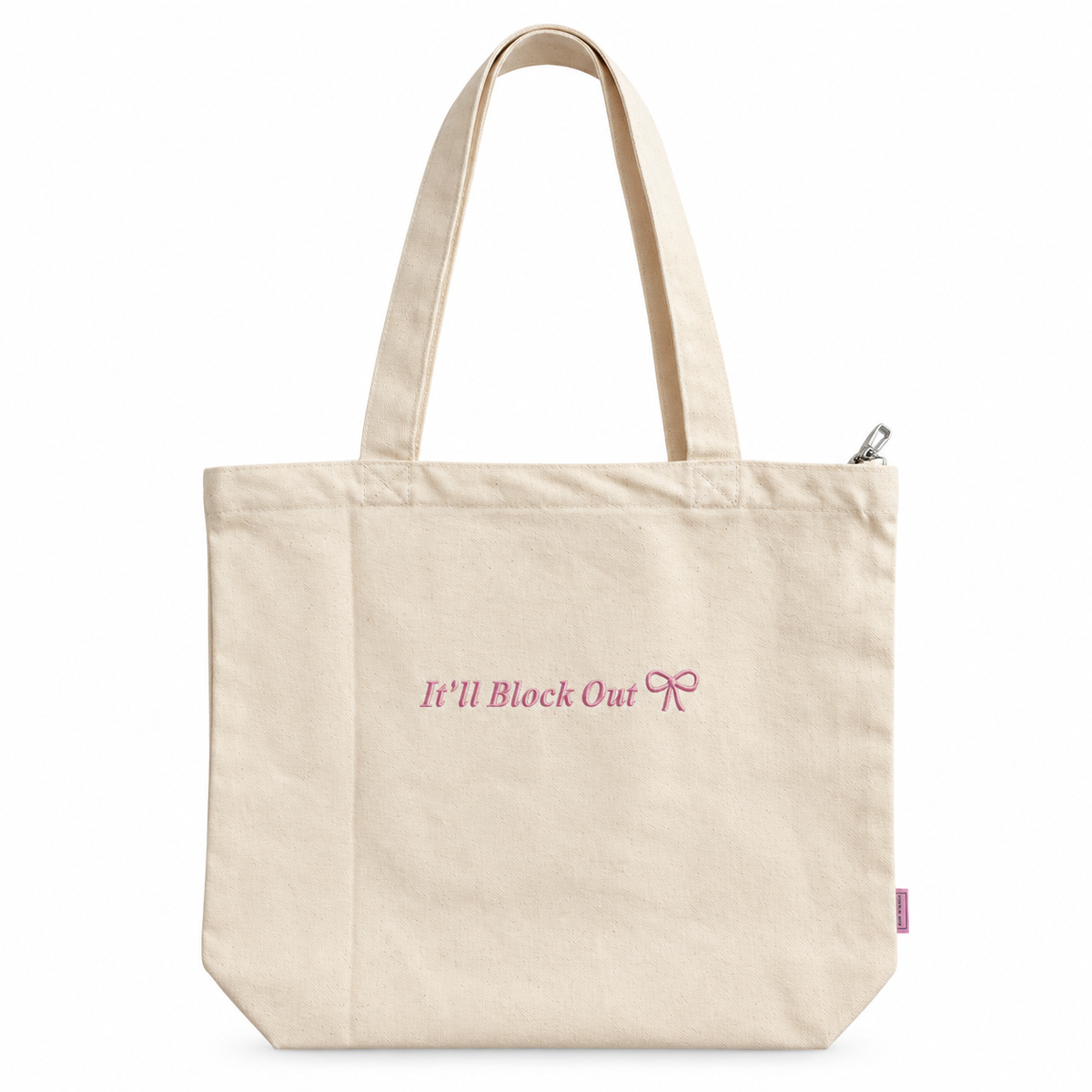 Natural canvas Studio Tote with baby pink “It’ll Block Out” Times embroidery and bow detail.
