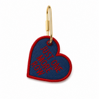 Lightly stuffed denim heart bag tag with red Just One More Row embroidery and gold-tone hardware
