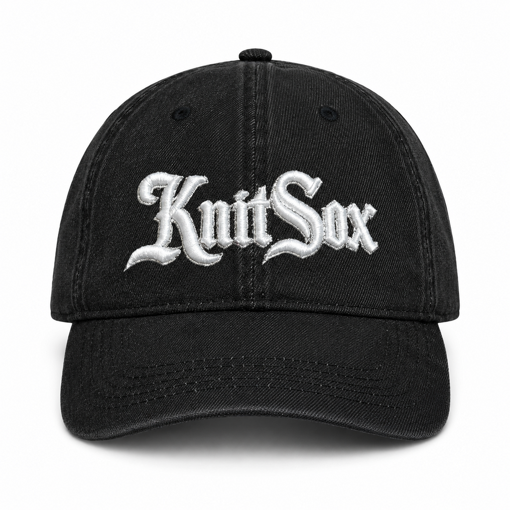 Black denim hat with Knit Sox white puff embroidery and metallic silver embroidered detail