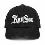 Black denim hat with Knit Sox white puff embroidery and metallic silver embroidered detail