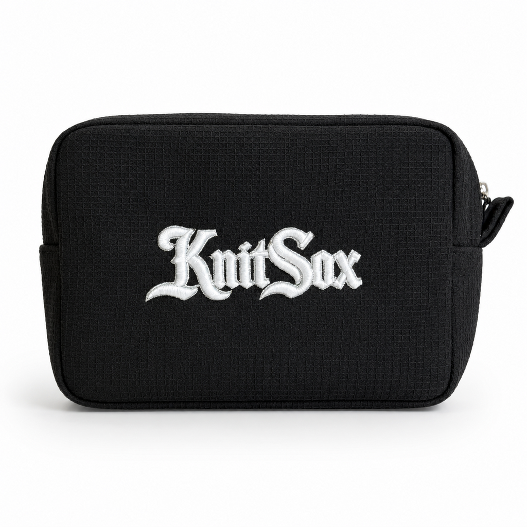 Black zip pouch with white Knit Sox puff embroidery