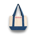 Tote bag with blue top half and beige bottom half, featuring the brand 'Knitfaced'.