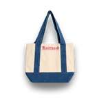 Tote bag with blue top half and beige bottom half, featuring the brand 'Knitfaced'.