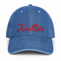 Medium denim hat with red chainstitch-style Knitter embroidery