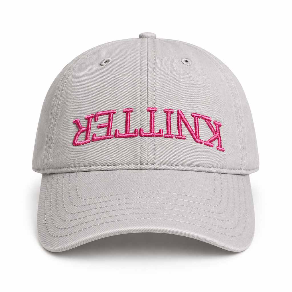 Grey hat with pink puff embroidered upside-down Knitter lettering