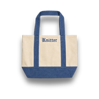 Tote bag with blue handles and bottom, featuring the brand 'Knitter'.