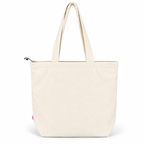 A plain canvas tote bag in a light cream or off-white color, featuring two shoulder straps and a small pink tag near the bottom left corner, set against a solid white background.