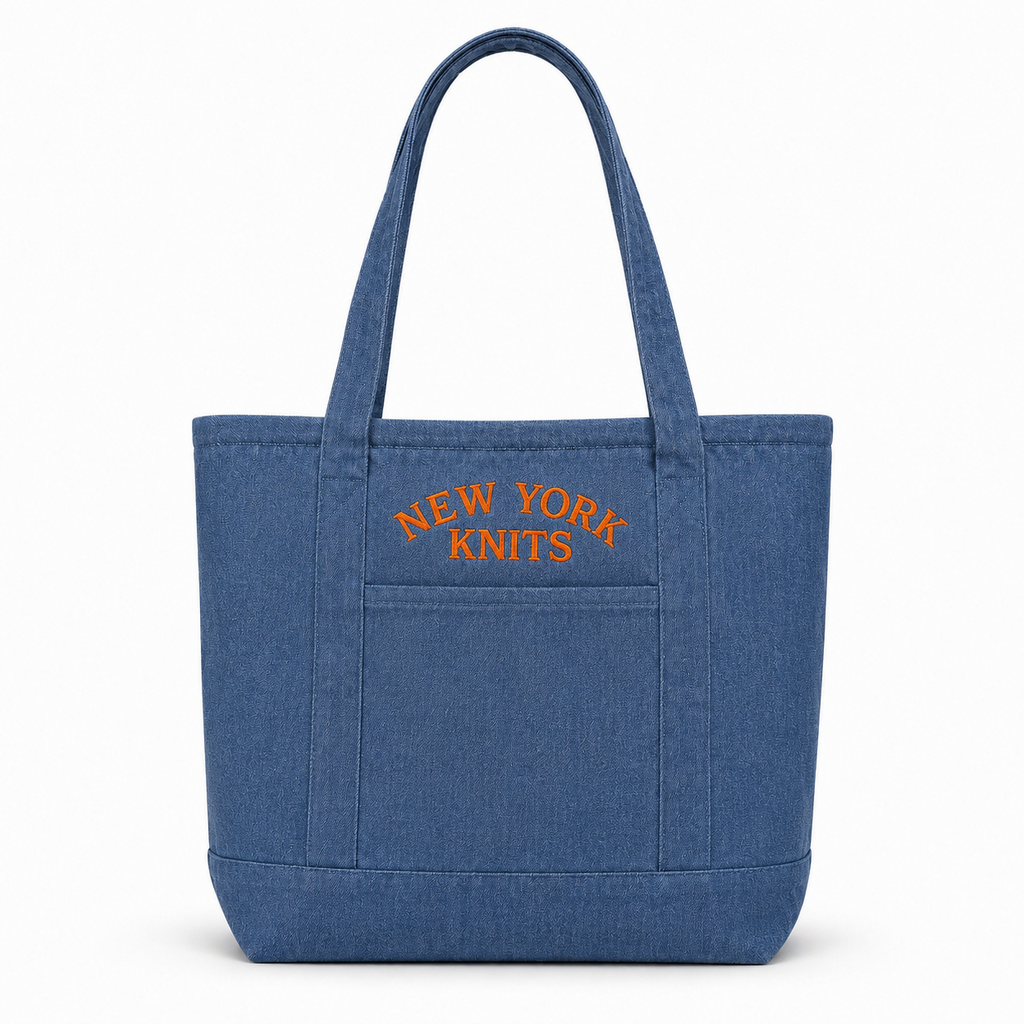 Denim tote bag with orange New York Knits embroidery above the front pocket