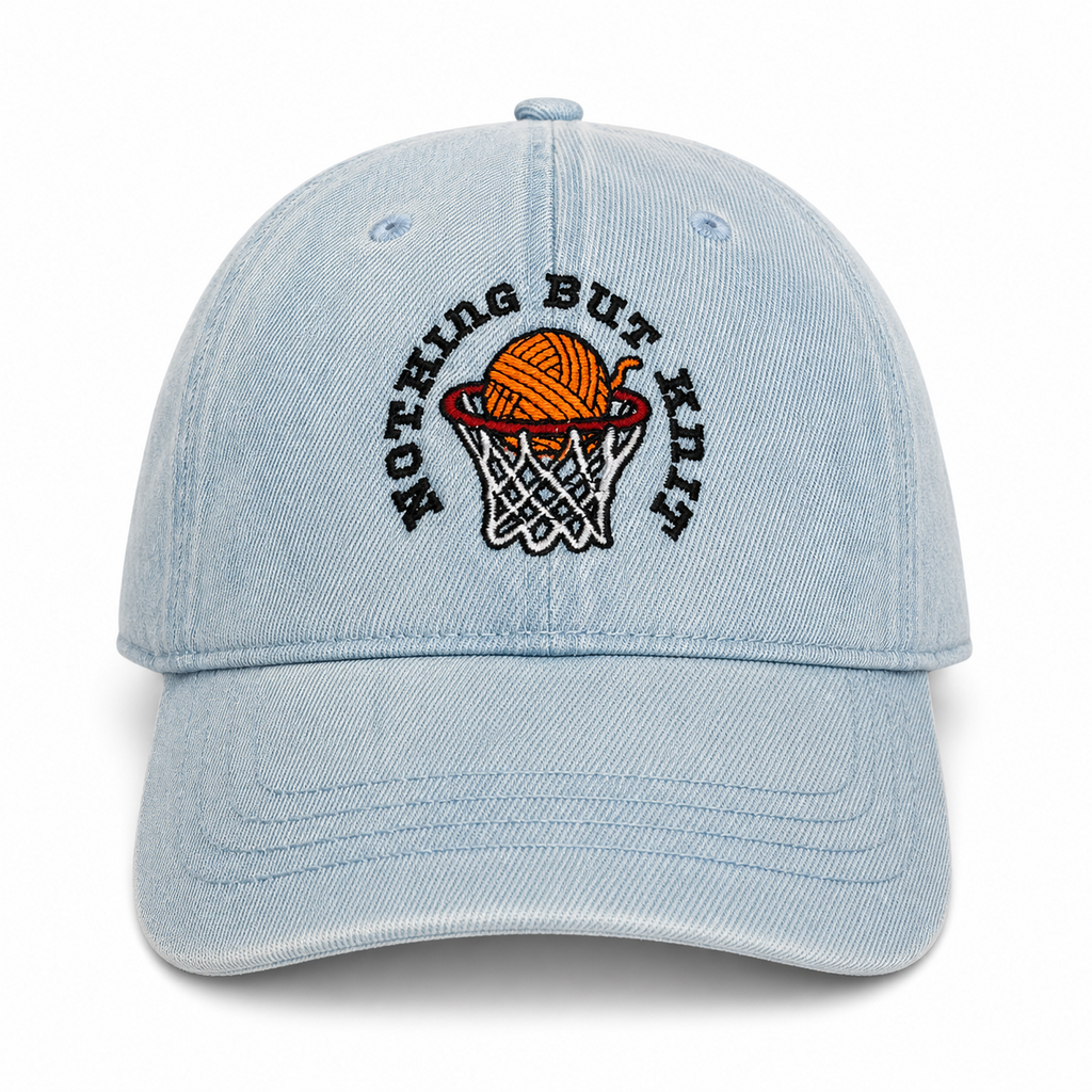 Light wash denim hat with Nothing But Knit embroidery and yarn ball hoop design