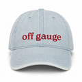 A light blue denim baseball cap with the words 'off gauge' embroidered in red across the front, shown against a plain white background.