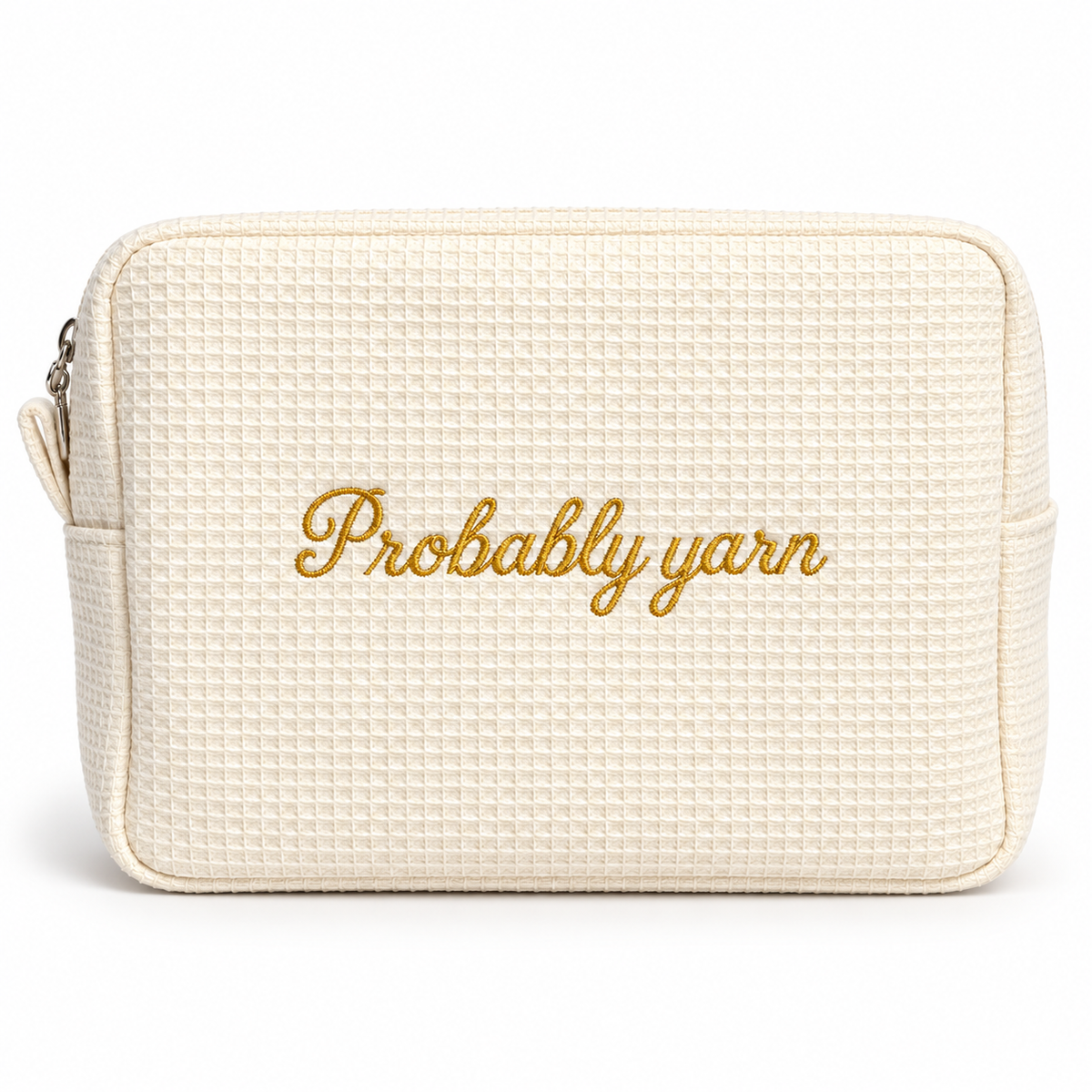 An off-white textured pouch with gold embroidered text reading 'Probably yarn' on the front, shown against a plain white background.
