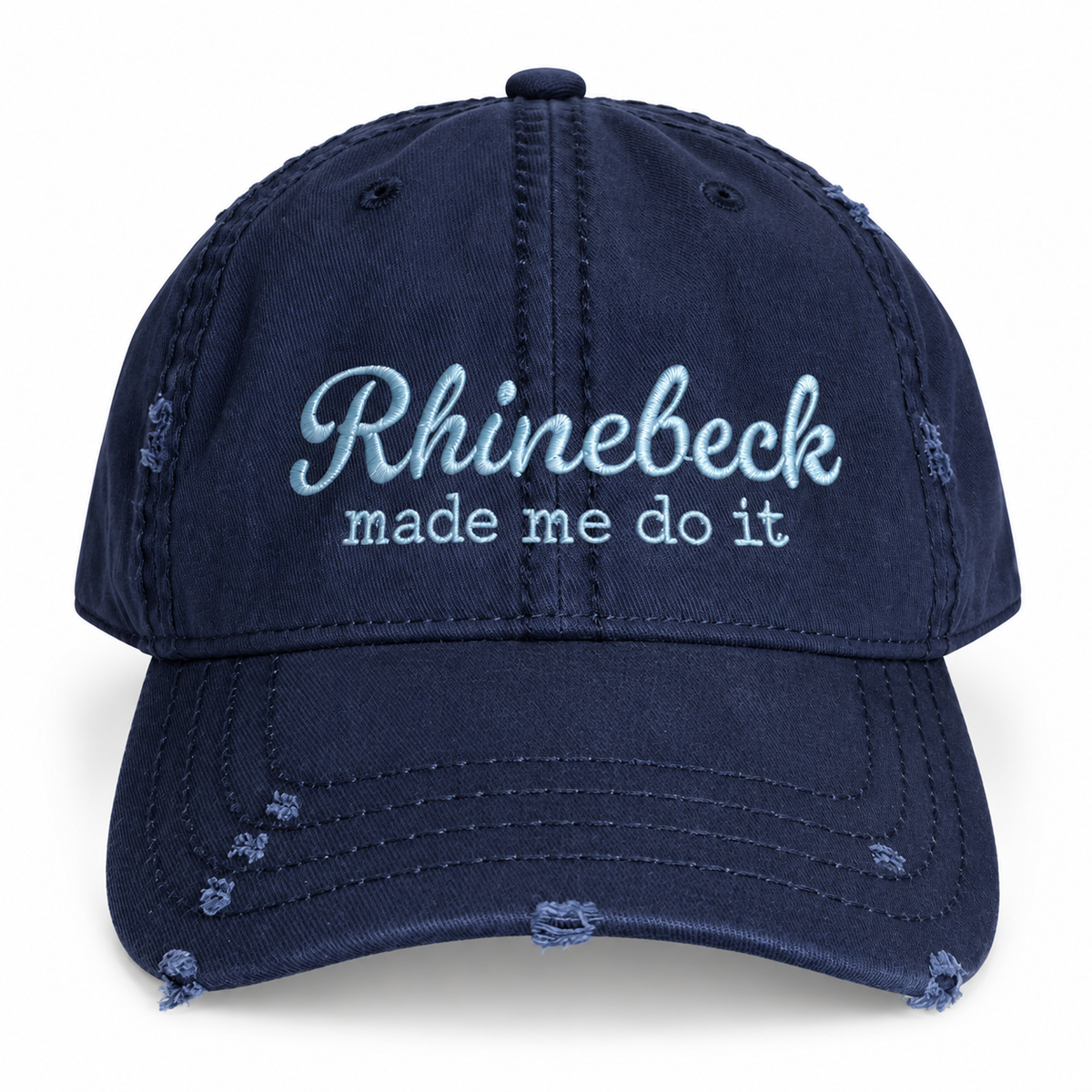 A navy blue distressed baseball cap with light blue embroidered text reading 'Rhinebeck made me do it' on the front, shown against a plain white background.