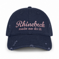 Distressed navy dad hat with pale pink “Rhinebeck Made Me Do It” embroidered lettering.