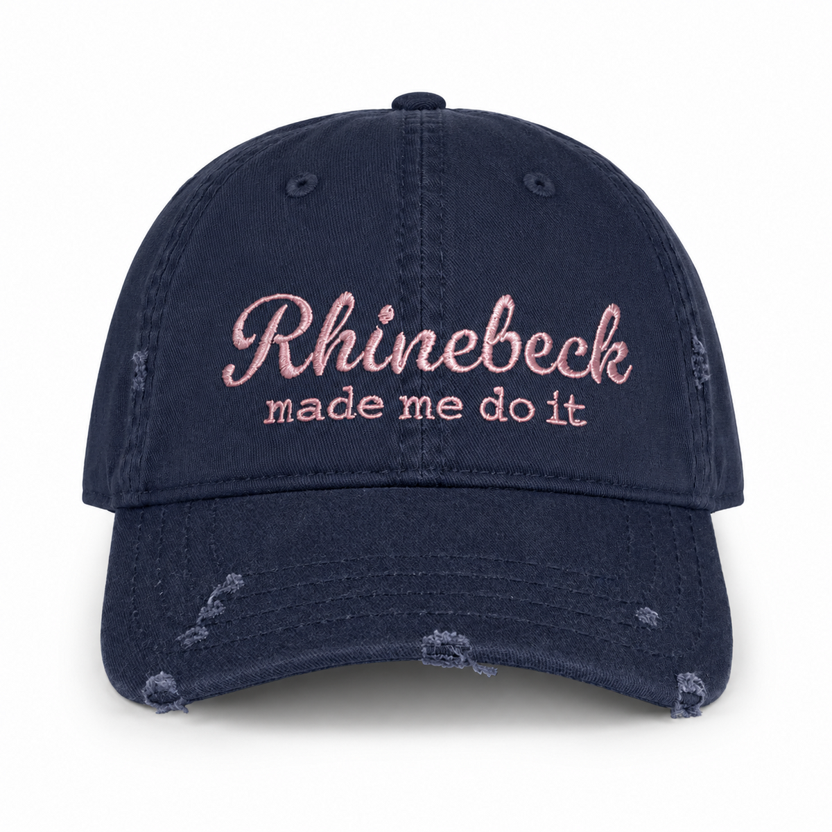 Distressed navy dad hat with pale pink “Rhinebeck Made Me Do It” embroidered lettering.