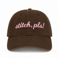Dark brown dad hat with pale pink 3D puff embroidery reading Stitch, Pls!