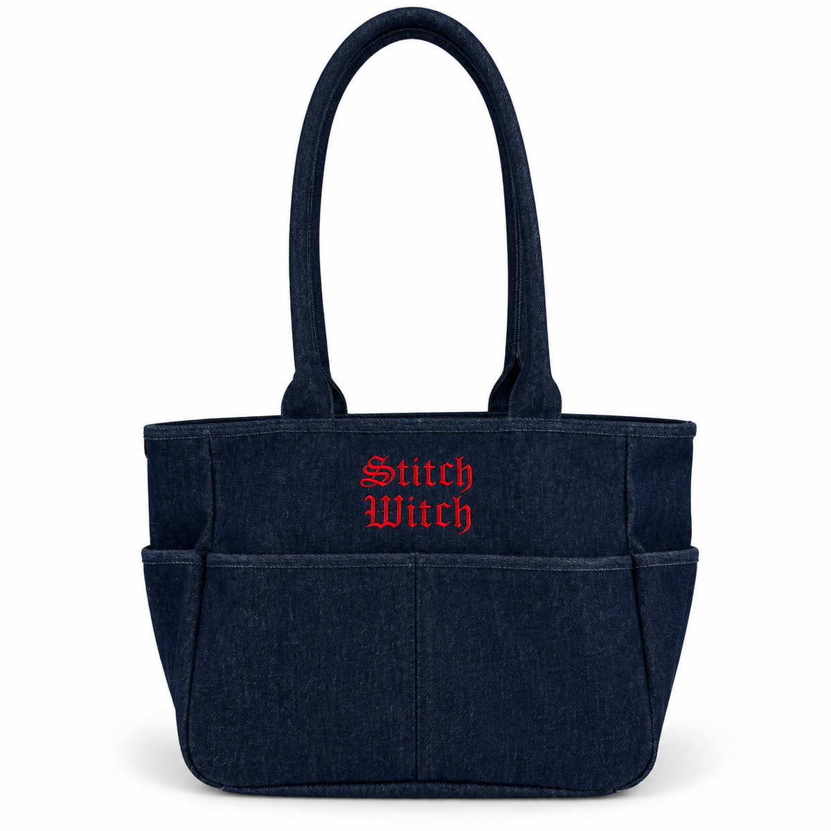 A dark navy blue fabric tote bag with two top handles, multiple front pockets, and 'Stitch Witch' embroidered in red Gothic-style lettering on the front, shown on a plain white background.