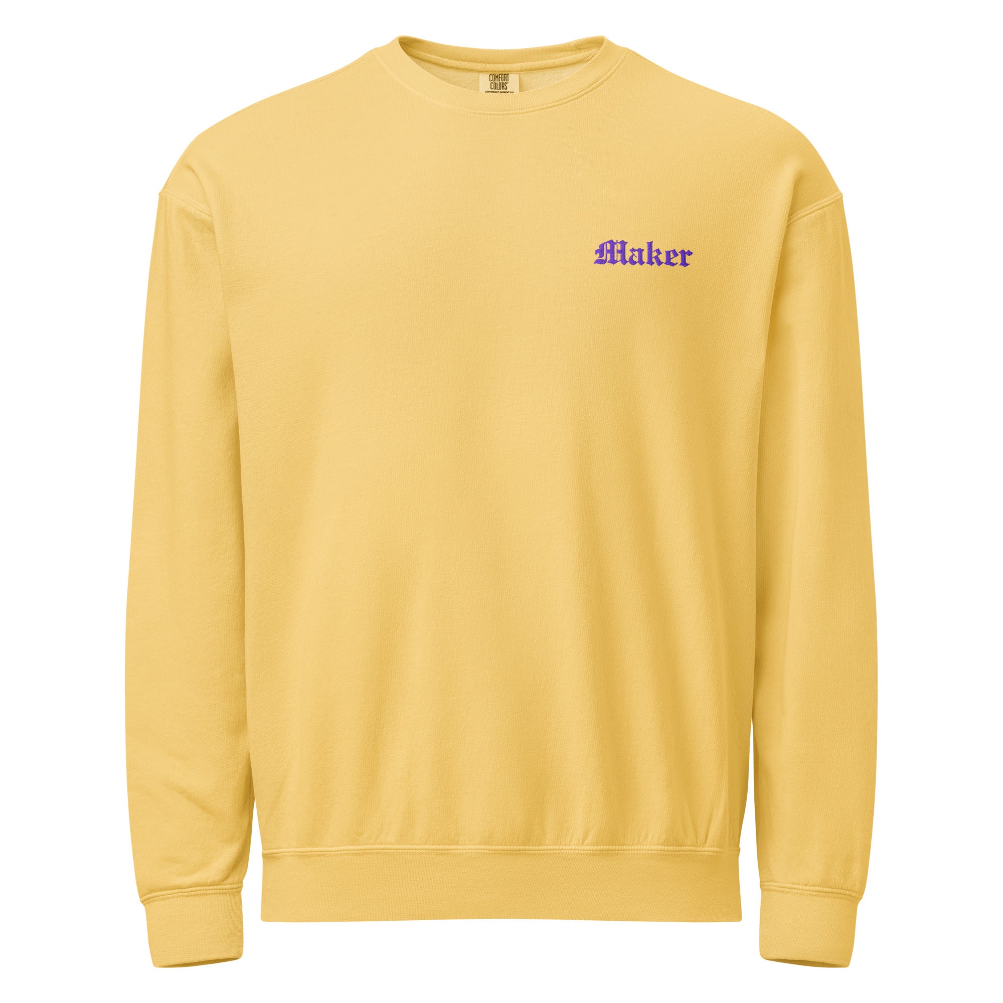 Yellow sweatshirt with 'Maker' text on a white background