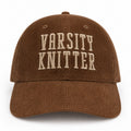 Brown corduroy hat with taupe puff embroidered Varsity Knitter lettering