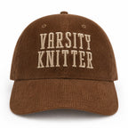 Brown corduroy hat with taupe puff embroidered Varsity Knitter lettering