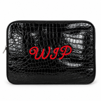A black crocodile-embossed zippered pouch with red embroidered cursive initials 'WIP' on the front, shown against a plain white background.